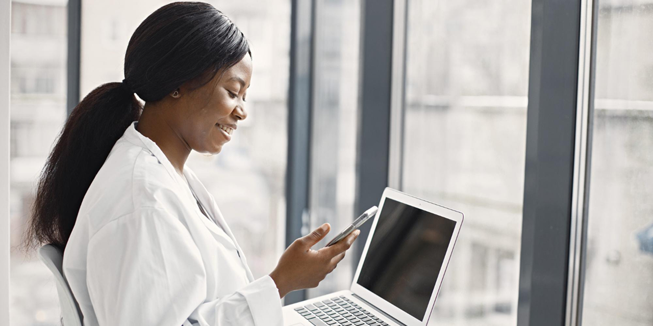 Healthcare professional using laptop